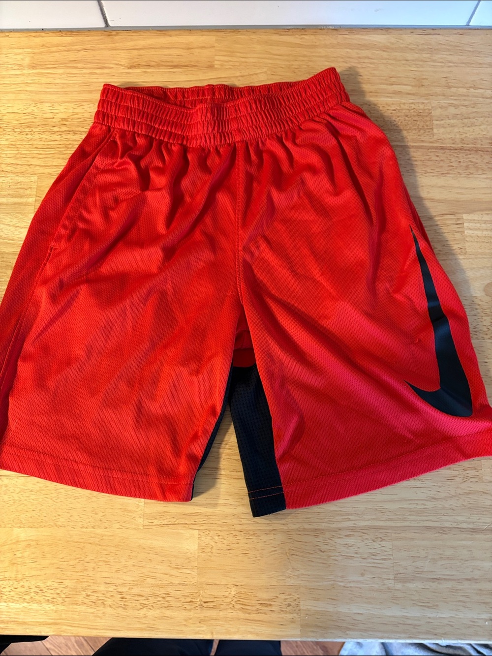Nike Red Mesh Sports Shorts with Black Swoosh